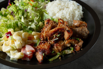 A closeup view of a chicken bulgogi lunch special plate.