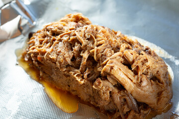 A closeup view of a pile of pulled pork.