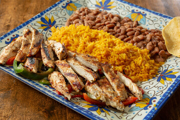 A view of a chicken fajita plate.