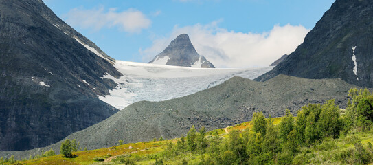 The melting Steindalsbreen Glacier and it's terminal moraine on a sunny summer day, Lyngen Alps,...