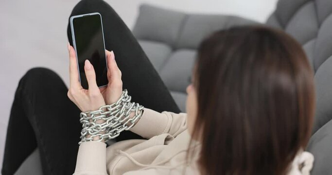 Woman with chain on hands with digital devices
