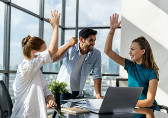 Group of happy businesspeople celebrate their successful project. Professional business team win...
