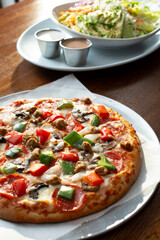 A view of a deluxe personal pizza.