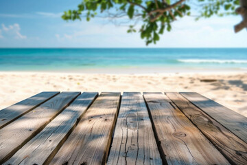 Fototapeta premium A wooden desk top with blurred background of beach. Good for background 