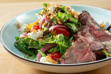 A closeup view of a steakhouse salad.