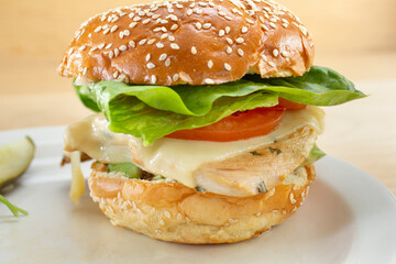 A closeup view of a grilled chicken sandwich.