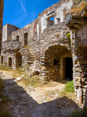 Fototapeta premium Kithira Kastro of Milopotamos Kato Chora Ionian islands, Greece. Old stonewall Venetian castle, abandoned building, monument at Kythera. 