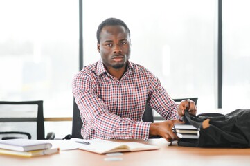 African student sitting in classroom. Male student during the lecture in high school classroom