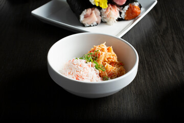 A view of a condiment cup of imitation crab meat. © DAVID