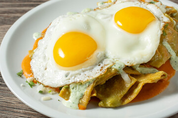 A closeup view of a plate of chilaquiles.