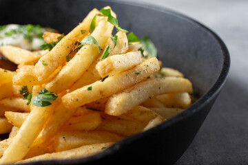 A closeup view of a pile of French fries.