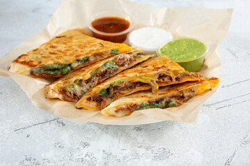 A view of a beef birria quesadilla.