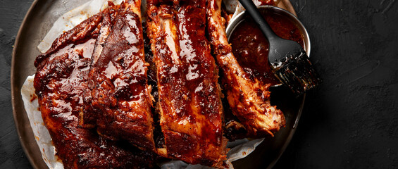 Grilled and smoked ribs with barbeque sauce.