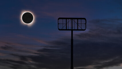 Beautiful Image of total solar eclipse as seen behind an empty metal sign frame against a partially...