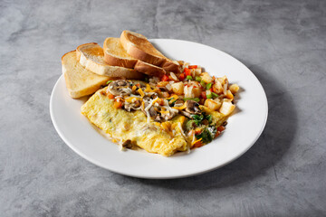 A view of a veggie omelet plate.