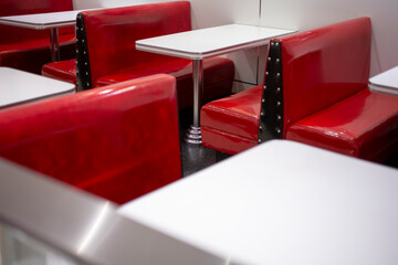 A view of several vintage restaurant banquette style bench seating in a local burger restaurant in...