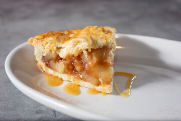 A view of a slice of apple pie.