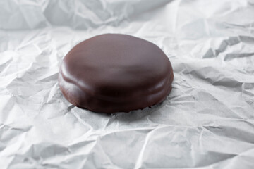 A view of a chocolate covered cookie.