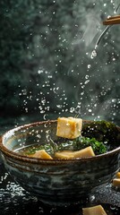 Miso soup, served with tofu and seaweed, traditional Japanese breakfast setting