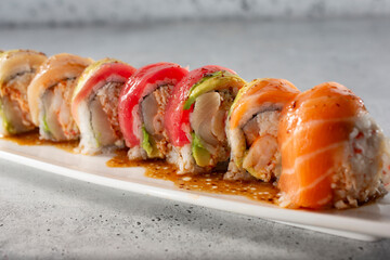 A closeup view of a rainbow roll.