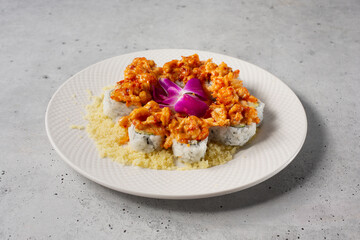 A view of a plate of baked lobster roll.