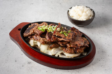 A view of a skillet of BBQ short rib.