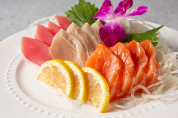 A view of a plate of assorted sashimi.