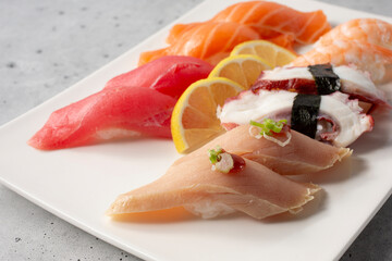 A view of a plate of assorted nigiri.