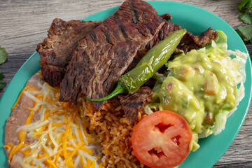 A top down view of a carne asada plate.