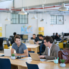 Cheerful, businessmen, and laptop, team, together and working at office for company startup or project. Happy, colleagues and teamwork with computer or paperwork for research planning in workplace