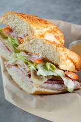 A view of a turkey and roast beef sandwich.