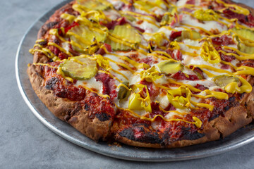 A view of a pastrami pizza.