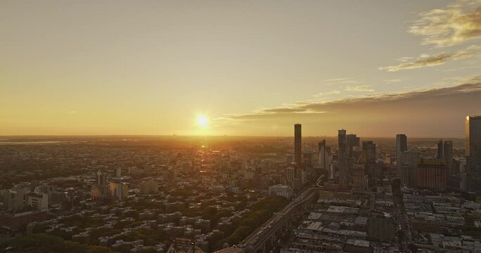 NYC New York Aerial v369 flyover East river and Queensboro Bridge capturing cityscape of Long Island City in Queens and glowing sun rising on the horizon - Shot with Mavic 3 Pro Cine - September 2023