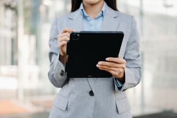 Confident businessman working on laptop,tablet and smartphone at her workplace ..