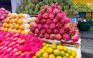 Dragon fruit on the market as a background