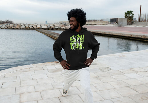 Mockup of man wearing customized hoodie lunging