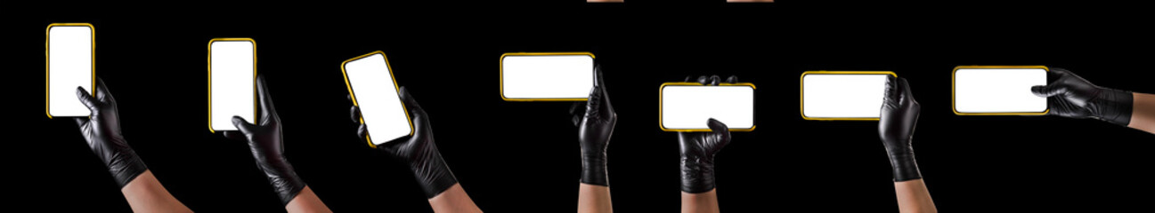 Hand in black glove holding mobile phone with blank screen isolated on black