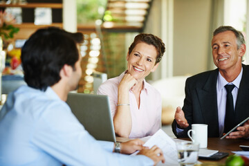 Business people, collaboration and laptop in office together for meeting, contract discussion or deal negotiation. Corporate, partner or employees with technology for b2b plan, teamwork and feedback