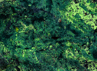 Abstract marble background of different shades of green. Black spots. Cold and light shades of green. Chaotic spots and blurs. Darker in places, lighter in places.