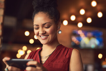 Cafe, happy woman or customer with smartphone for typing, online review and digital order with...