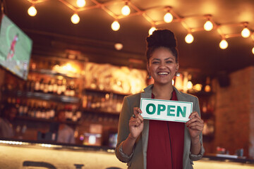 Happy, woman and portrait with open sign in restaurant for customer service, welcome and start of...