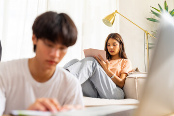 Group of Young Asian man and woman university college students using laptop computer and tablet for...