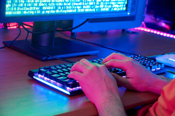 A gamer making strategic moves on a keyboard in an engaging game session
