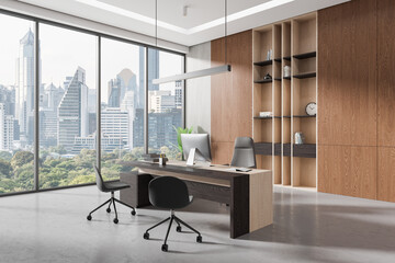 Cozy workspace interior with ceo desk and shelf with panoramic window