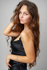 Fototapeta premium Woman in Black Dress Posing for Picture