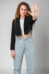 Woman With Curly Hair Holding Hand Up