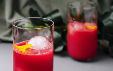 Refreshing citrus cocktail in glasses