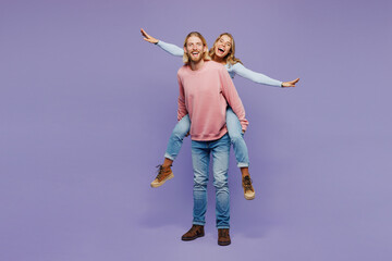 Full body young couple two friend family man woman wear pink blue casual clothes together giving...