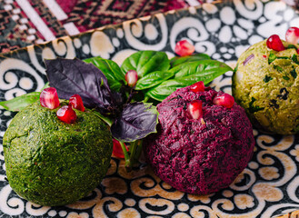 Colorful trio of gourmet vegan balls on decorative plate