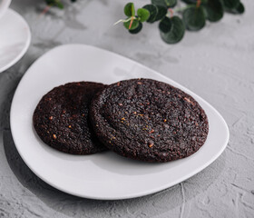 Fresh chocolate cookies on grey stone